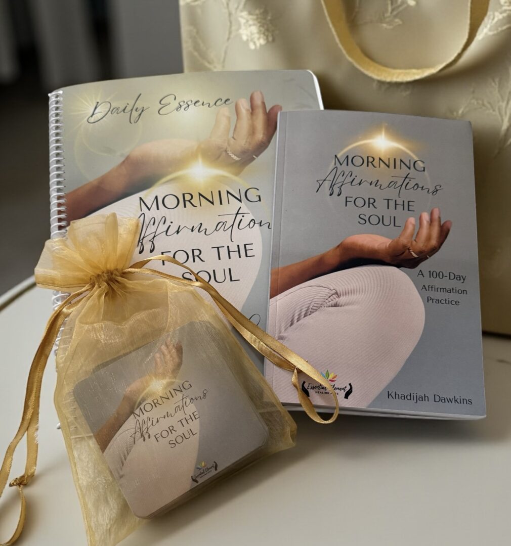 Books titled 'Morning Affirmations for the Soul' with a yellow gift bag and a small pouch on a white surface.