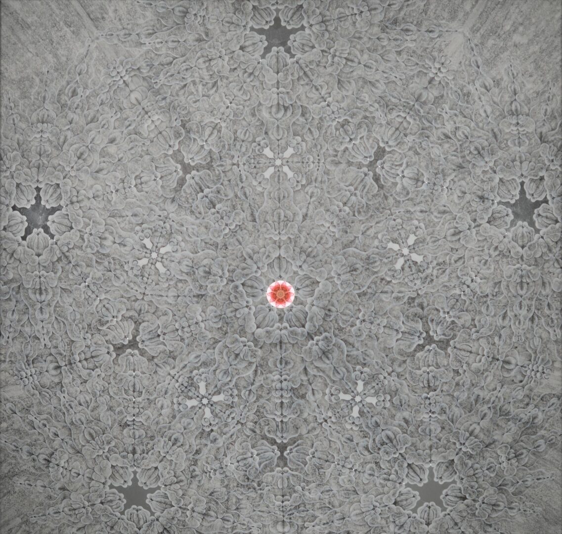 Gray patterned surface with a small red and white object in the center.